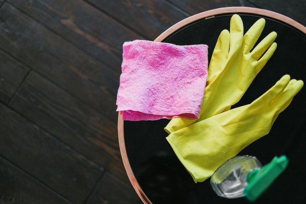 Cleaning supplies for removing carpet tape residue from a wood floor without damaging the finish