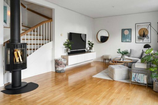 Narrow plank hardwood floor in a living room showing a classic look and a tighter visual rhythm across the space