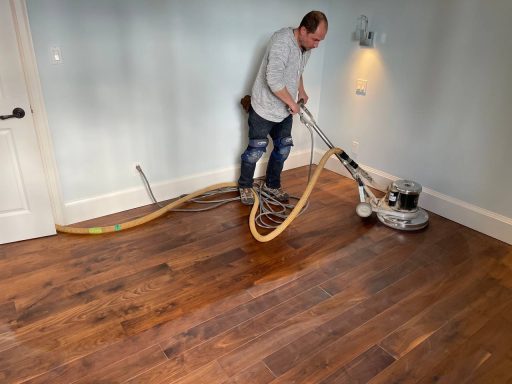 Buff and recoat hardwood floor without sanding using light abrasion to refresh the finish layer without cutting into the wood
