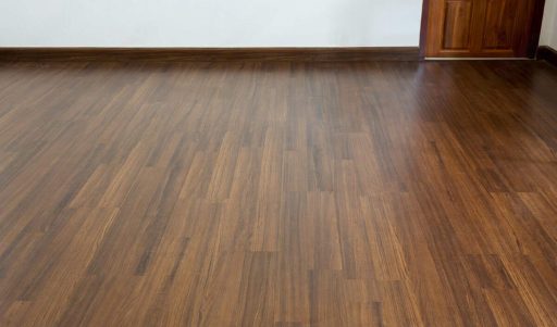 Hardwood floor with protective sealant showing a smooth surface and consistent finished appearance