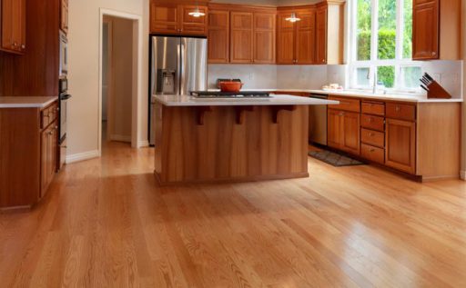 Sealed hardwood floor in kitchen showing a clean finished surface with everyday moisture protection