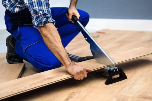 Cutting floorboard for hardwood floor repair during a board replacement step before sealing and refinishing the floor