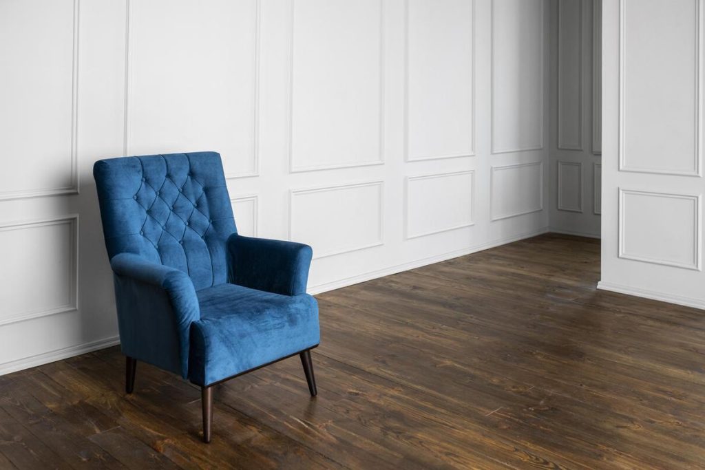 Dark hardwood floor after moisture repair showing a restored surface once damaged boards have been repaired or replaced