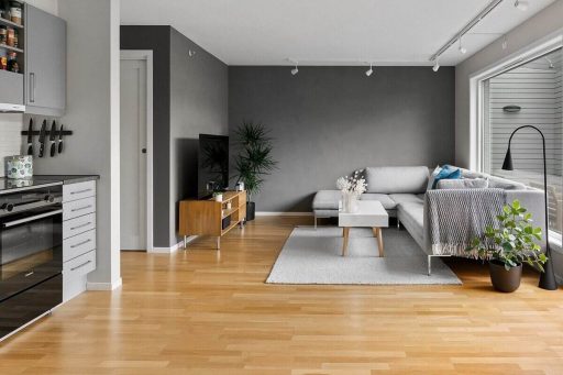 Engineered hardwood floor in an open living space showing the kind of finished surface homeowners want to preserve before sanding