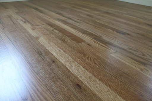 Hardwood flooring with natural grain variation and mixed wood tones
