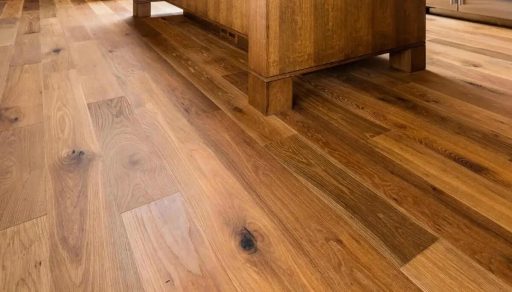 Refinished hardwood floor with natural oak planks and visible wood grain in a modern interior