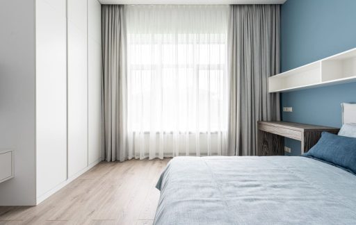 Light hardwood floor in a bedroom with soft natural light and minimalist design