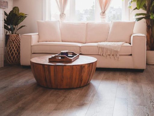 Refinished hardwood floor in a living room showing the clean finished look homeowners invest in during restoration
