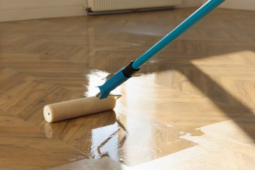 Rolling a polyurethane finish onto a freshly refinished hardwood floor