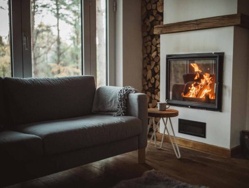 Warm hardwood floor in a cozy living room with fireplace and natural wood tones