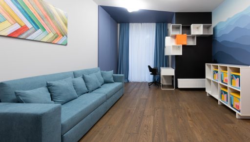 Wide plank wood floor in a modern room showing longer board lines and a calm open visual flow